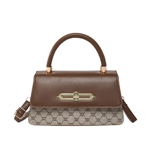 Vintage style bi-color crossbody bag with brown leather and geometric pattern fabric