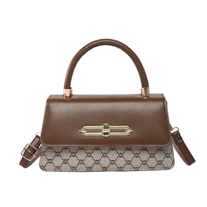Retro patchwork crossbody bag with brown leather flap and geometric chain canvas pattern