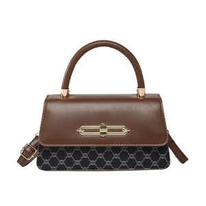 Retro brown and black patchwork handbag with gold metal lock and crossbody strap