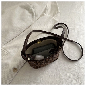 Top view of mini leopard bucket bag showing interior storage with daily essentials