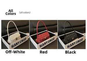 Detailed close-up of small tweed shoulder bags in white, red, and black with gold clasps
