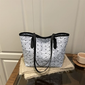 Ice blue tote bag with black bow patterns and pleated texture for fashion women