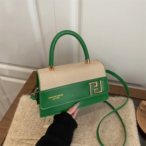 Green and beige patchwork leather shoulder bag with gold hardware and top handle