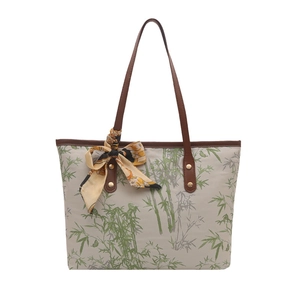 New Chinese style tote bag featuring green bamboo print and decorative silk scarf detail