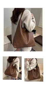 Detailed view of the dark brown woven texture on this large oversized shoulder tote bag