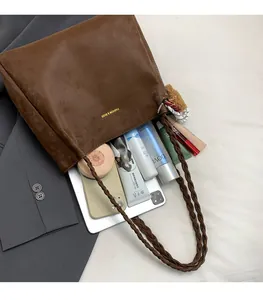 Top view of a large brown tote bag showing ample space for tablets and cosmetics