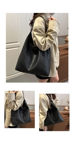 Detail of black woven large tote bag in soft faux leather with spacious interior