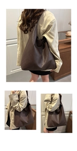 Detailed close-up showing the intricate woven texture of the dark brown hobo tote bag