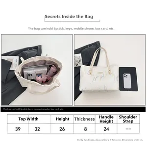 Detailed size chart and capacity display for white canvas tote bag with embroidery