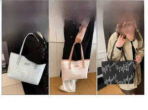 Three large tote bags with 3D wave embroidery in blue, pink, and black colors