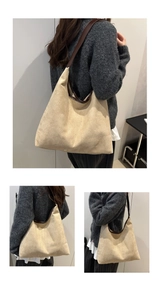 Detail of minimalist beige suede tote bag with brown leather strap in a chic hobo style