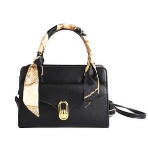 Classic black leather handbag with gold metal clasp and floral scarf wrapped handle