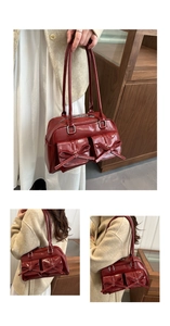 Detail of red patent leather shoulder bag with chic bow accents and dual handles