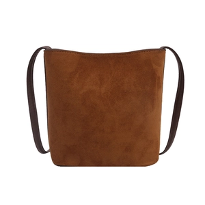Chic vintage leopard suede shoulder bag in caramel brown with slim dark straps
