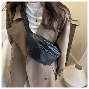 Close-up of minimalist black lychee texture PU leather chest bag with heavy-duty plastic buckle