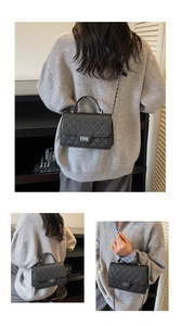 Detailed views of a black quilted leather handbag with metal chain strap and top handle