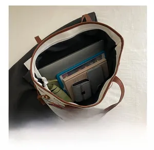 Spacious tote bag interior showing capacity for laptop, tablet, and daily essentials