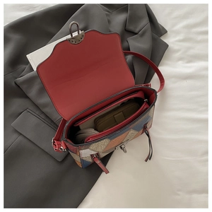 Detail view of the colorful crossbody bag interior with multiple storage compartments