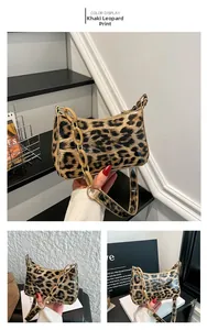 Detail showing leopard khaki crescent bag with thick acrylic chain strap and zip closure