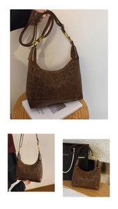 Detailed close-up of brown leopard print hobo bag with gold metal buckle and embossed logo