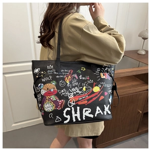 Detail of black pebbled leather tote bag with colorful street graffiti and bear prints
