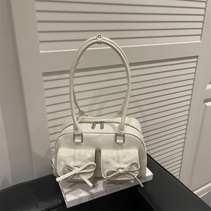Cream white glossy patent leather Boston bag with bow accents and large capacity