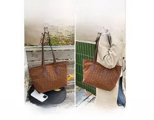 Leopard print tote bag showing handheld and shoulder carry styles on a park bench