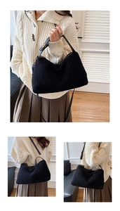 Detailansicht der schwarzen Lammwoll-Tote-Bag mit Ledergriffen und verstellbarem Riemen