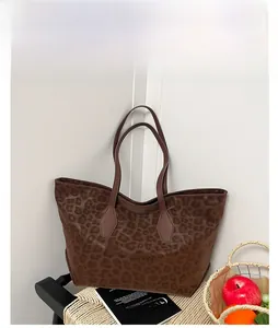 Detailed view of leopard print tote bag in brown with sleek shoulder straps and large capacity