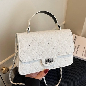 Elegant white quilted crossbody bag with silver twist lock and chain strap for women