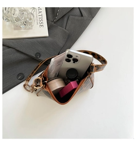 Internal view of leopard print shoulder bag showing large capacity for essentials