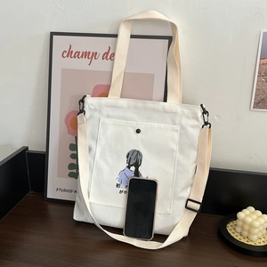Minimalist white canvas tote bag with artistic illustration and adjustable shoulder strap