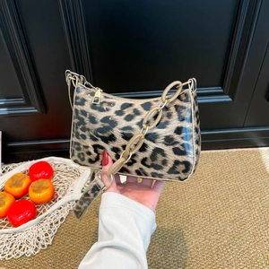 Glossy leopard print underarm bag with cream chain strap and vintage shoulder design