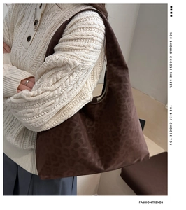 Detail of vintage leopard print tote bag in dark brown showing soft textured fabric