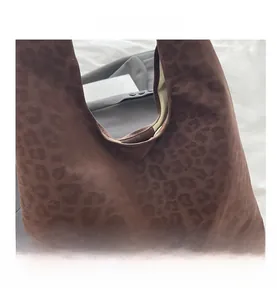 Detail of soft faux suede leopard print tote bag with dark brown animal texture