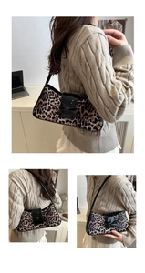Detail view of leopard print shoulder bag with black glossy flap and bow decoration
