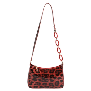 Glossy leopard print underarm bag with bold red acrylic chain and golden hardware