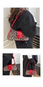 Detail of red bow accent and leopard print texture on fashion shoulder underarm bag