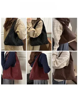 Three leopard print tote bags in black, burgundy and dark brown shown on a model