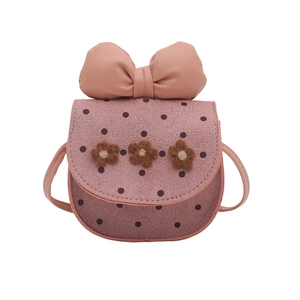 Mini crossbody bag for kids with pink polka dots and oversized decorative bow