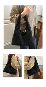 Detailed view of large leopard print hobo tote bag with soft velvet texture and wide strap