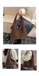 Detail of vintage brown leopard print tote bag with soft suede-like texture for women