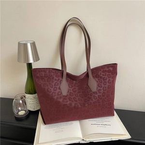 Deep red leopard print tote bag with textured faux leather and long handles for women