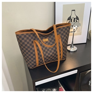 Detail of checkered tote bag with FASHION & BAGS logo and brown long shoulder straps