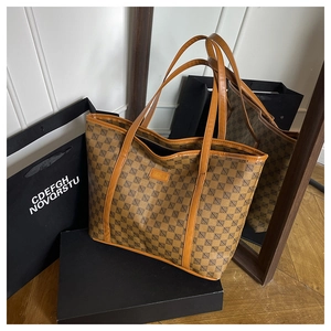 Detailed view of brown printed tote bag with high-quality geometric pattern on a gift box