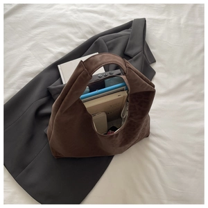 Deep brown suede tote bag with leopard print showing a large interior storage capacity