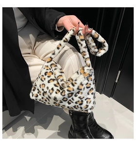 Close-up of soft leopard print faux fur handbag with high-quality plush texture detail