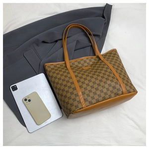 Top view of a large vintage print tote bag with tablet and phone for size reference