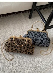 Detail of leopard print shell bags in two colors with gold metal handles and chain straps