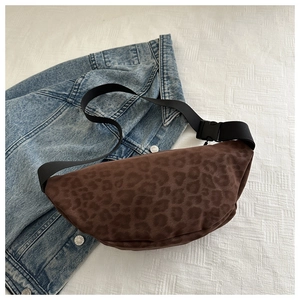 Vintage leopard print crossbody waist bag styled on blue denim for autumn fashion look